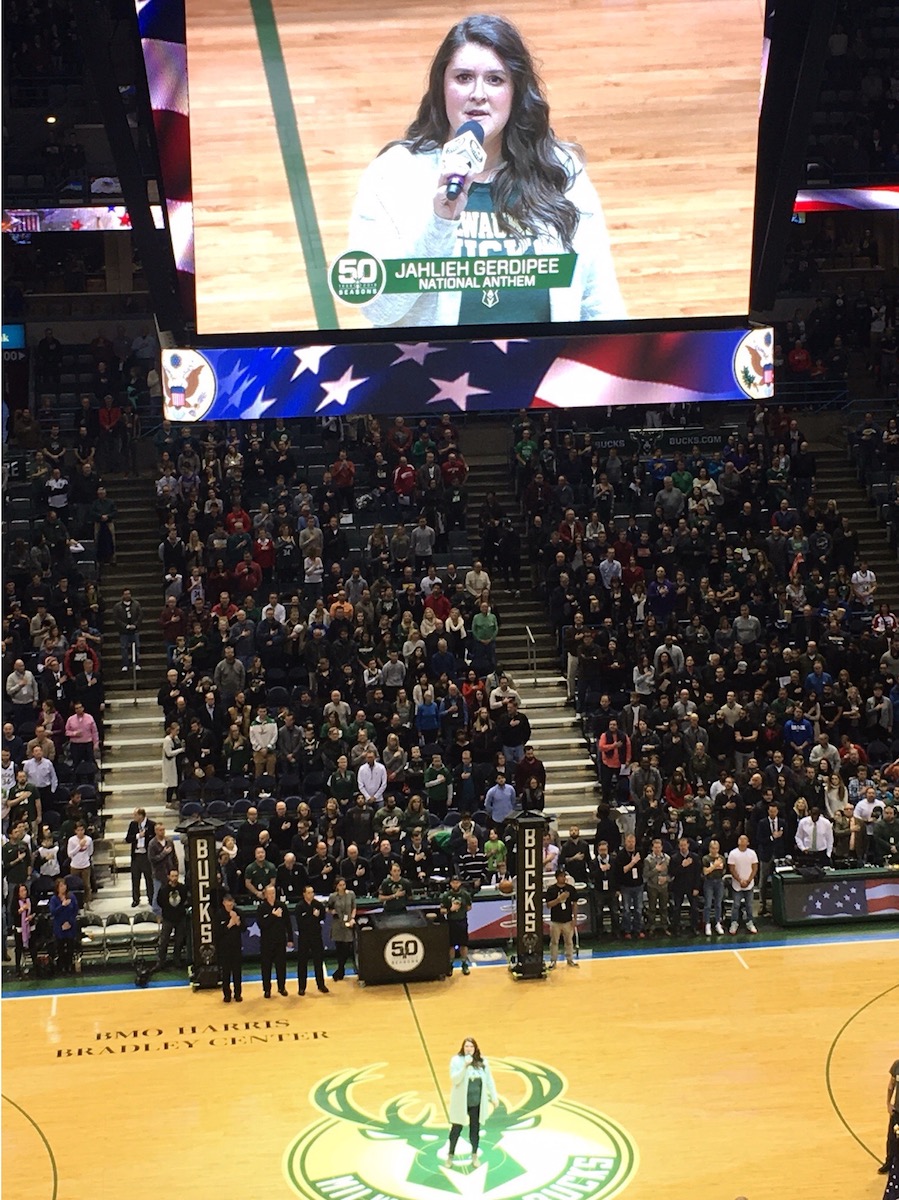 Jahlieh Gardipee singing national anthem at professional basketball game